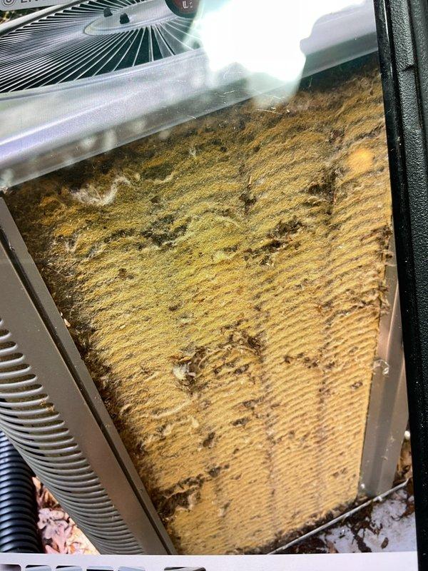 Responded to no cooling complaint on residential air conditioning system. Upon inspection, found unit extremely dirty with low refrigerant charge. Evidence of previous ice buildup on evaporator coil had melted, with condensation present on suction line. Performed thorough cleaning of condenser coil and system components to restore proper airflow and heat transfer. Added refrigerant to bring system to manufacturer specifications. Unit tested and operating normally with proper cooling upon completion.