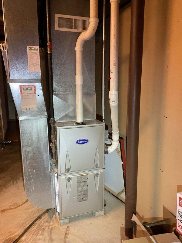 Performed air conditioning clean and check on Carrier HVAC system. Outdoor unit was found to be dirty and was thoroughly cleaned with water to restore proper airflow and efficiency. System was inspected and passed all operational checks for state surveyor documentation requirements.