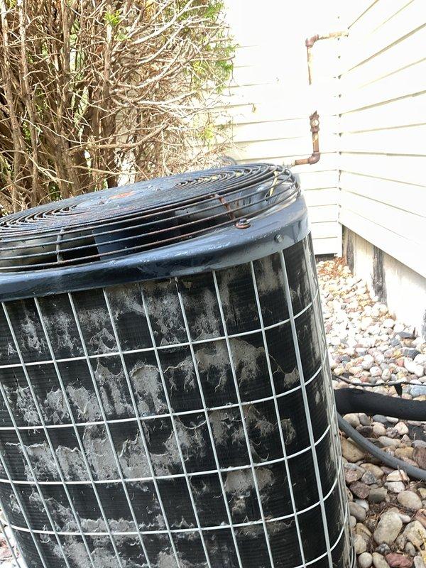 Performed comprehensive inspection and maintenance on outdoor air conditioning condenser unit. System was found to be low on refrigerant and operating with reduced efficiency due to accumulated dirt and debris on condenser coils. Rinsed down condenser coils to remove buildup, replaced air filter, and recharged system with appropriate amount of Freon to manufacturer specifications. Unit failed initial inspection due to refrigerant deficiency and contaminated components but was restored to operational status following service completion.