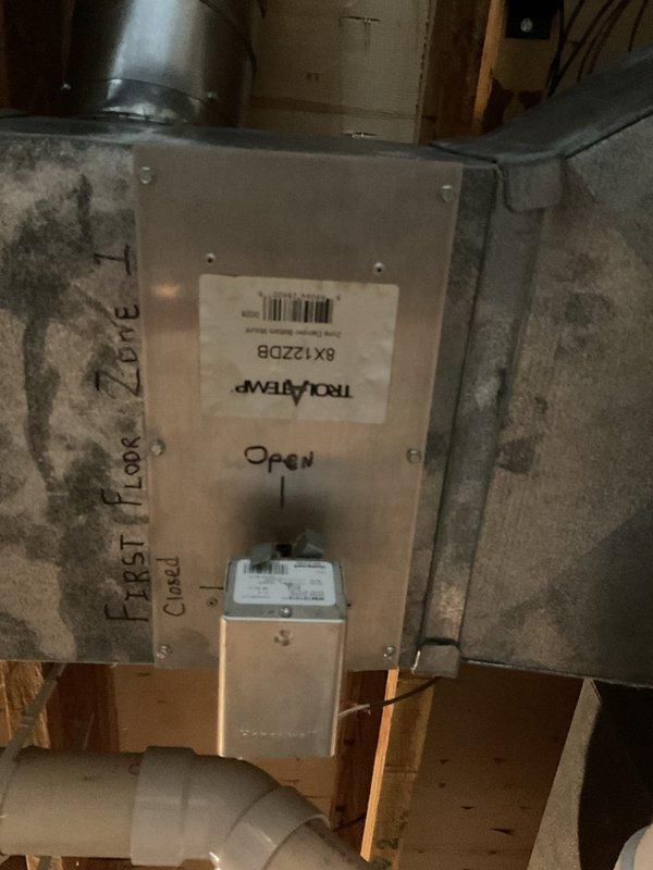 Responded to service call for 16-year-old residential air conditioning unit experiencing refrigerant leak and lack of cooling. Upon inspection, confirmed system was low on refrigerant and identified active leak in outdoor condensing unit. Performed comprehensive system evaluation including electrical connections, condenser coil condition, and compressor operation. Due to the age of the equipment, extent of the leak, and cost-effectiveness of repair versus replacement, advised customer that unit replacement is recommended at this time. Documented system condition with photographs showing interior components of outdoor unit and associated indoor air handler zone control panel. Customer informed of findings and replacement options.
