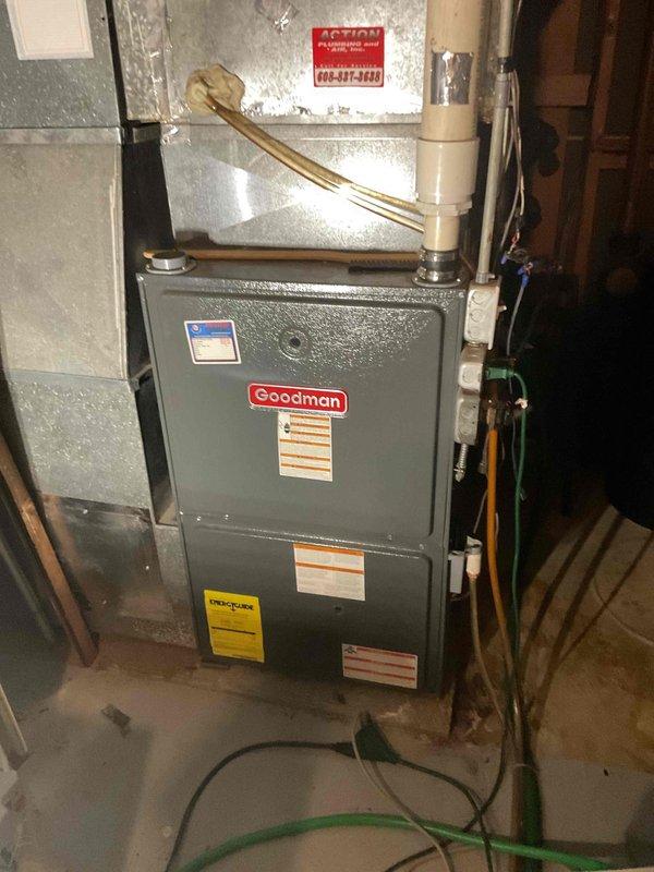 Responded to no cooling complaint on residential air conditioning system. Diagnosed failed compressor with system running but not producing cold air. Additionally identified faulty door control switch on Goodman furnace unit. Recommended complete compressor replacement due to component failure.