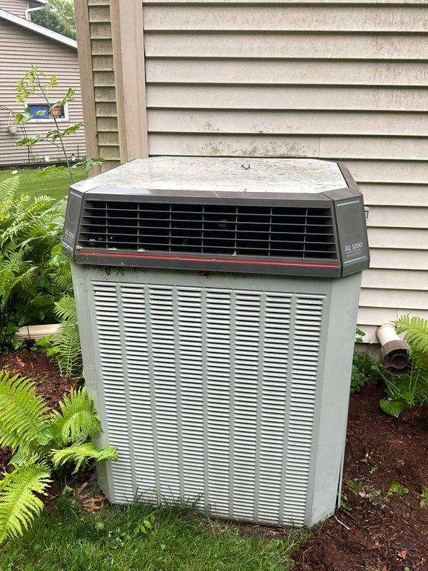 Responded to no cooling complaint on residential air conditioning system. Upon inspection, found outdoor condenser unit with significant refrigerant loss on a system approximately 20 years old. Evaluated system condition and determined unit had reached end of serviceable life. Documented equipment condition with photos of outdoor condenser unit and electrical panel. Advised customer that system requires replacement due to age and refrigerant loss, as repair would not be cost-effective at this stage of equipment lifecycle.