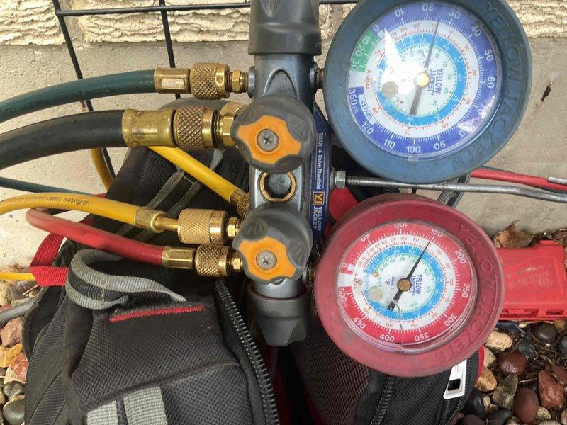Responded to no cooling complaint on residential air conditioning system. Upon arrival, found unit had previously frozen and was experiencing inadequate cooling performance. Connected manifold gauges to outdoor condensing unit and performed refrigerant pressure diagnostics. Testing revealed system was low on refrigerant charge, indicating a leak in the refrigerant circuit. Due to the age and condition of the equipment, along with the refrigerant loss, recommended full system replacement rather than repair. Customer was advised to monitor unit and power off if freezing occurs again to prevent compressor damage.