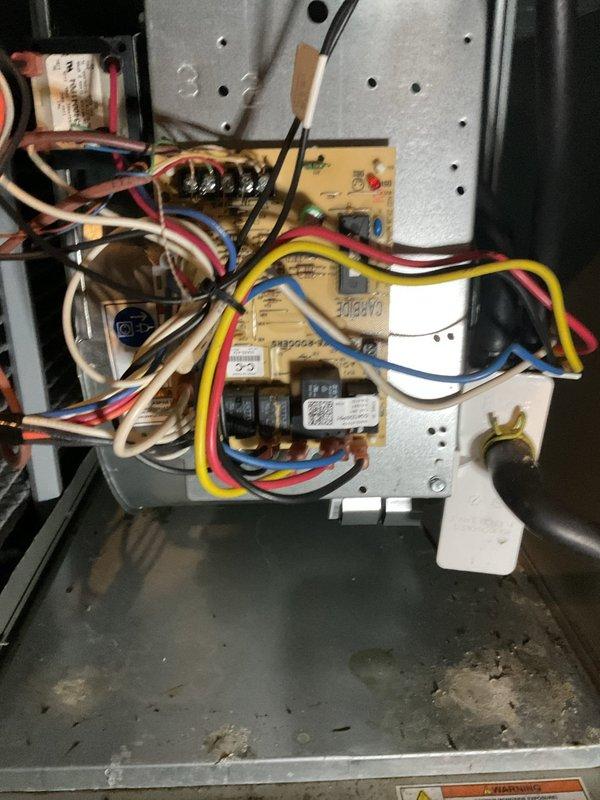 Responded to no cooling complaint with frozen evaporator coils on American Standard system. Diagnosed failed furnace control board preventing proper system operation. Replaced defective control board, restored power to unit, and verified proper system functionality with normal cooling operation resumed.