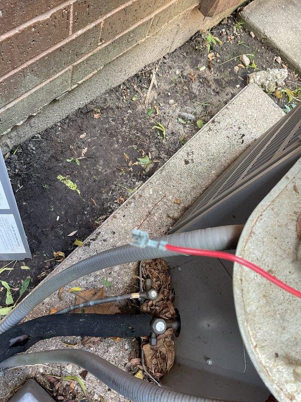 Responded to no cooling complaint on residential air conditioning system. Upon arrival, discovered broken connector on low voltage control wiring preventing unit operation. Repaired damaged wiring connection and restored proper electrical continuity to control circuit. Verified system startup and checked refrigerant pressures to confirm proper operation. Unit tested successfully and returned to normal cooling function.
