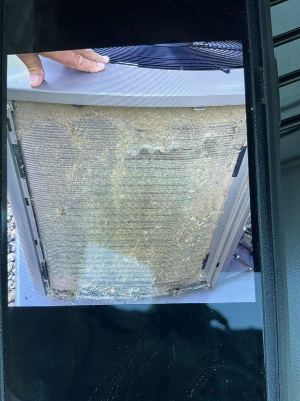 Completed prepaid maintenance package AC clean and check on Lennox outdoor condensing unit. Found condenser coil heavily soiled with dirt and debris accumulation restricting airflow. Thoroughly cleaned condenser coil and verified proper system operation upon completion.