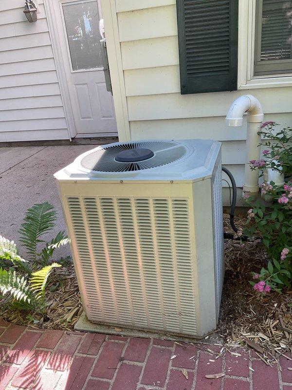 Responded to no cooling complaint on early 2000s residential air conditioning system. Upon inspection, diagnosed compressor with locked rotor condition on 20-year-old outdoor condensing unit. Unit has exceeded its expected service life and is not economically repairable. Recommended complete system replacement.