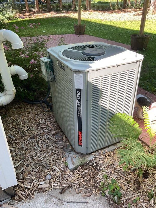 Responded to no cooling complaint on early 2000s residential air conditioning system. Upon inspection, diagnosed compressor with locked rotor condition on 20-year-old outdoor condensing unit. Unit has exceeded its expected service life and is not economically repairable. Recommended complete system replacement.