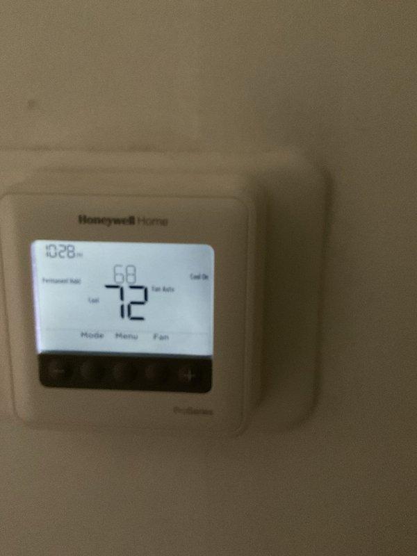 Responded to no-cooling complaint after thermostat was removed and reset to factory settings. Upon arrival, verified thermostat functionality and found Honeywell Home digital unit operating correctly with display showing proper temperature readings and system status. Performed comprehensive system inspection of both HVAC units and confirmed both are running properly with cooling cycle engaged and fan operation normal.