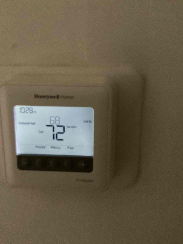Responded to no-cooling complaint after thermostat was removed and reset to factory settings. Upon arrival, verified thermostat functionality and found Honeywell Home digital unit operating correctly with display showing proper temperature readings and system status. Performed comprehensive system inspection of both HVAC units and confirmed both are running properly with cooling cycle engaged and fan operation normal.
