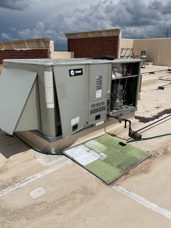 Responded to no cooling complaint on commercial rooftop Trane packaged HVAC unit. Upon inspection, diagnosed failed control board preventing system operation. Accessed unit through exterior panel, confirmed control board failure through visual inspection and system diagnostics. Located and replaced defective control board with compatible replacement part. Verified proper system operation, tested cooling cycle, and confirmed all functions restored to normal operating parameters before closing access panel and completing service.
