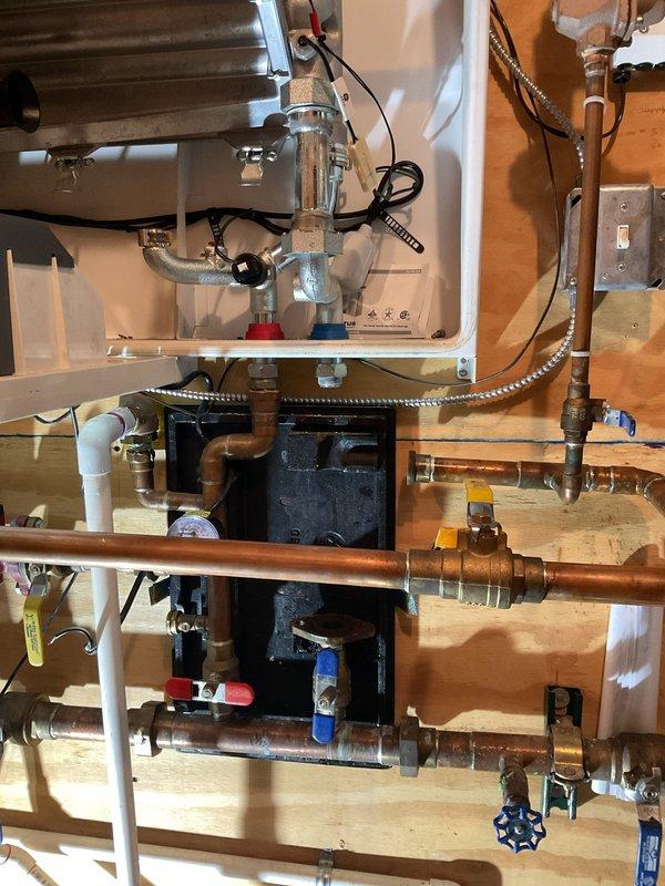 Responded to boiler leak emergency and performed comprehensive repair including replacement of flue connector, circulating pump, gaskets, and flame sensor. Modified existing piping system by repiping section of pump connection to replace corroded tee fitting that was contributing to the leak. All copper connections were properly soldered, system was pressure tested for leaks, and boiler was returned to safe operating condition.