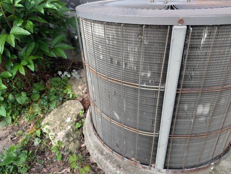 Performed comprehensive AC clean and check on 20-year-old outdoor condenser unit with visible hail damage to protective mesh grille and extensive rust staining. Inspected condenser fins for hail damage and assessed overall system condition. Conducted furnace inspection to evaluate replacement needs. Attempted to tighten loose kitchen faucet but determined mounting hardware is cross-threaded and cannot be secured. Both HVAC systems have reached end of service life and require replacement. Faucet requires new installation due to damaged threading. Customer advised of findings and replacement recommendations for all three items.