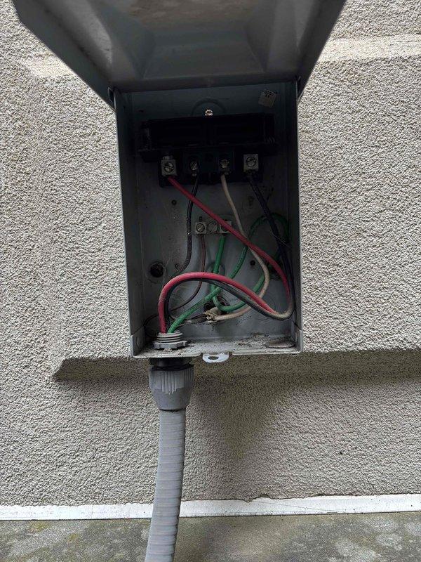 Responded to no cooling complaint on residential air conditioning system. Upon inspection, found failed capacitor and complete loss of refrigerant charge. Evaluated electrical components including disconnect box and circuit breaker panel. Due to the combination of failed capacitor, total refrigerant loss, and overall system condition, recommended complete unit replacement as most cost-effective solution for the customer.