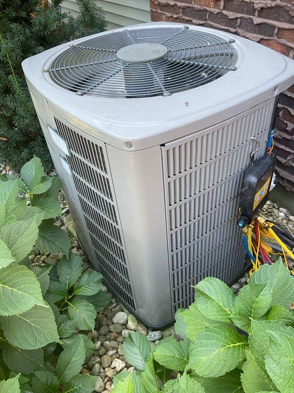 Responded to no cooling complaint on outdoor Trane condensing unit over 10 years old. Upon inspection, discovered damaged wire connection and heavily soiled capacitor terminals preventing proper electrical contact. Repaired broken wire, installed new terminal on capacitor, and thoroughly cleaned capacitor terminals and connections to restore proper electrical flow. Unit tested successfully after repairs with condenser fan and compressor operating normally.
