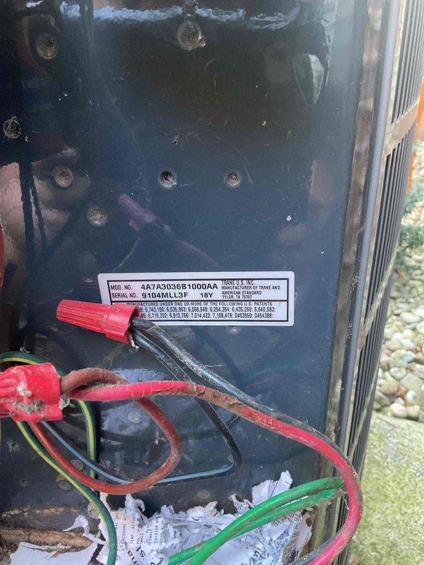Responded to no cooling complaint on outdoor Trane condensing unit over 10 years old. Upon inspection, discovered damaged wire connection and heavily soiled capacitor terminals preventing proper electrical contact. Repaired broken wire, installed new terminal on capacitor, and thoroughly cleaned capacitor terminals and connections to restore proper electrical flow. Unit tested successfully after repairs with condenser fan and compressor operating normally.