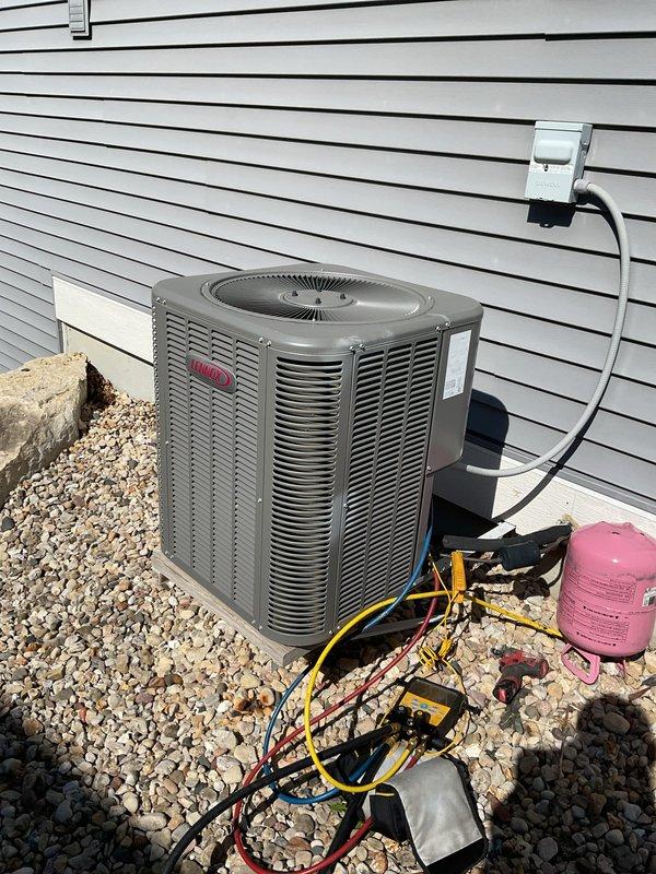 Performed complete clean and check maintenance on 2018 Lennox furnace system that had not received service in its 7-year lifespan. Conducted thorough inspection of all furnace components, performed basic cleaning procedures, and verified proper operation of heating system. Additionally addressed air conditioning unit experiencing no cooling condition with lack of cold air output. Deployed manifold gauge set and refrigerant testing equipment at outdoor condensing unit to diagnose cooling system issue and restore proper AC operation.