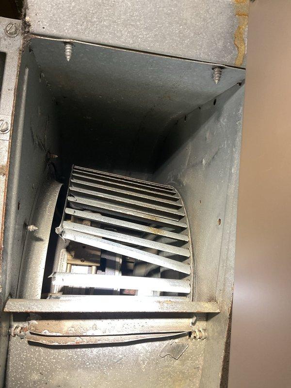 Responded to service call for air conditioning unit producing grinding noise while still providing cooling. Upon inspection, diagnosed mechanical issue within the air handler assembly. Inspected blower motor, fan assembly, and associated components for signs of wear or obstruction causing the reported noise. Unit found operational with adequate airflow through supply registers, though abnormal sound confirmed during operation. Documented equipment condition with photos showing air handler installation and HVAC system configuration for service records.