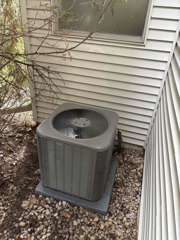 Responded to callback for noise complaint from outdoor condenser unit on recently installed system. Upon arrival, inspected condenser unit and surrounding installation area. Unit was operational and cooling properly at time of inspection. Performed visual examination of condenser housing, fan assembly, mounting hardware, and concrete pad for any loose components or debris that could cause abnormal sounds. Verified unit was level on pad and properly secured. Documented current condition of installation with photos showing condenser positioning, clearances, and overall system setup for service records.