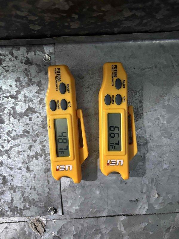 Responded to service call for Luxaire furnace with active water leak occurring during air conditioning operation. Upon arrival, confirmed significant water accumulation on and around 12-year-old furnace unit. Diagnostic inspection revealed condensate drainage issue associated with evaporator coil operation. Temperature differential measurements confirmed cooling system operation with supply air temperature at -4.8°F and return air at 65.7°F, indicating proper refrigerant cycle but improper condensate management. Identified clogged or disconnected condensate drain line as primary cause of water leak. Documented equipment condition and leak source with photographs for service records.