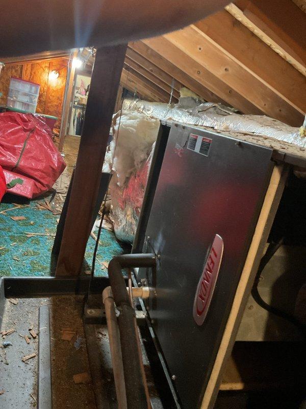 Responded to no cooling call on 2012 Lennox system that sustained lightning damage. Inspected attic-mounted air handler and control board, which showed evidence of electrical damage from lightning strike. Documented system condition with photos of air handler installation and damaged control board (part #02791-01). Customer informed of extent of damage and opted to pursue system replacement rather than repair due to age of equipment and severity of lightning-related failure.