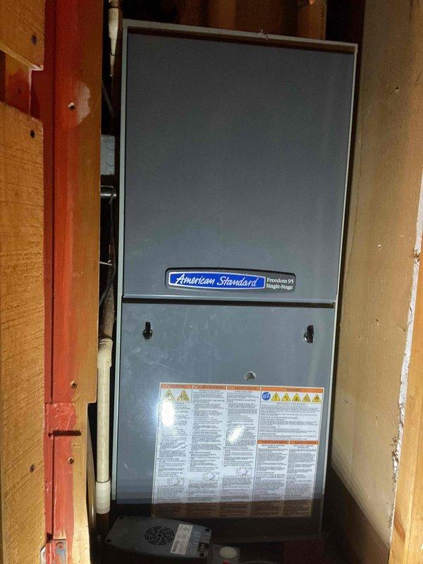 Completed comprehensive furnace clean and check on American Standard Freedom 95 single-stage unit in response to customer report of humming noise. Identified loose 24V transformer as source of noise complaint and secured mounting hardware to eliminate vibration. Performed full system inspection including gas valve assembly, blower motor operation, electrical connections, and safety controls with all components testing within normal parameters.