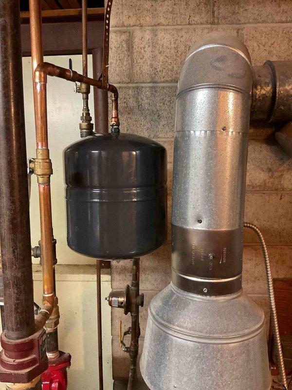 Responded to service call for leaking boiler system components. Upon inspection, identified failed expansion tank with active leak compromising system pressure integrity. Removed defective expansion tank and installed new pressure tank with proper mounting hardware. Replaced three deteriorated ball valves on copper piping connections to ensure proper system isolation and flow control. Tested all connections for leaks, verified proper system pressurization, and confirmed operational functionality of heating system components upon completion.
