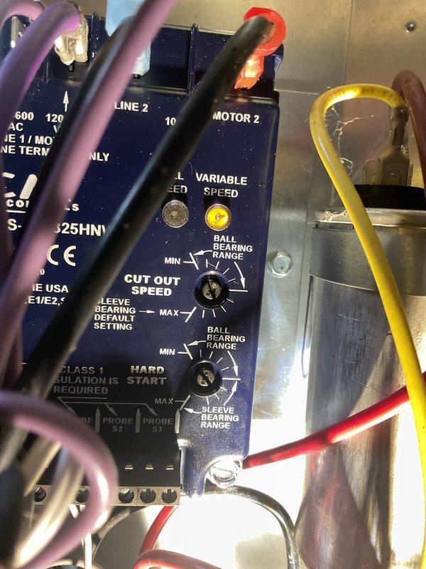 Installed low ambient kit and crankcase heater on air conditioning unit to enable operation in cooler outdoor temperatures and protect compressor during off-cycles. Configured variable speed motor control module settings and verified proper wiring connections to all components. System tested and operational with enhanced cold weather protection capabilities.
