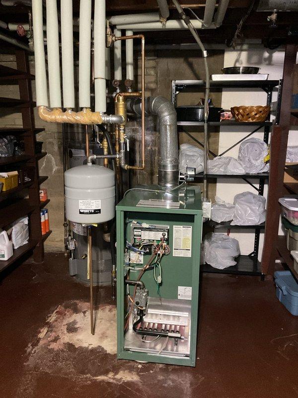 Performed comprehensive clean and check on recently installed boiler system, confirming all components operating within manufacturer specifications. Conducted combustion analysis showing CO levels at 4 ppm and CO2 at 4.1%, indicating proper burner efficiency and safe operation. Inspected expansion tank, circulator connections, and all copper and PVC piping for leaks or wear, finding system in excellent condition with no immediate service needs identified.