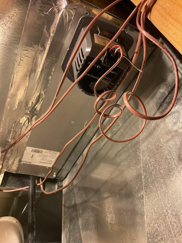 Responded to service call for furnace making high-pitched noise and zone adjustment request. Upon inspection, examined air handler unit in attic space with multiple refrigerant lines and electrical controls. Verified Aprilaire air filter system operation and checked filter media dating from June 2024. Diagnosed noise issue, performed necessary adjustments to resolve the high-pitched sound, and completed requested zone configuration changes to optimize system performance.