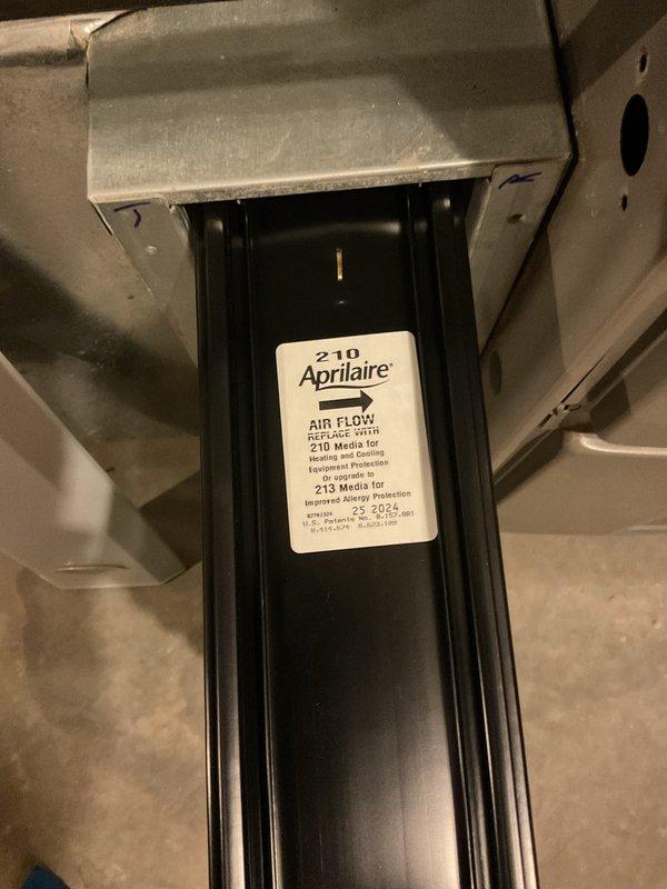 Responded to service call for furnace making high-pitched noise and zone adjustment request. Upon inspection, examined air handler unit in attic space with multiple refrigerant lines and electrical controls. Verified Aprilaire air filter system operation and checked filter media dating from June 2024. Diagnosed noise issue, performed necessary adjustments to resolve the high-pitched sound, and completed requested zone configuration changes to optimize system performance.