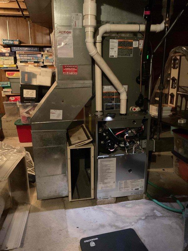 Completed comprehensive furnace tune-up on residential gas-fired forced air unit. Performed system diagnostics revealing igniter resistance at 50 ohms and combustion analysis showing 6 ppm carbon monoxide output. Cleaned flame sensor, replaced air filter, cleared drain trap debris, and tightened all electrical connections. Verified blower motor operation and confirmed unit heating properly with safe operational parameters.