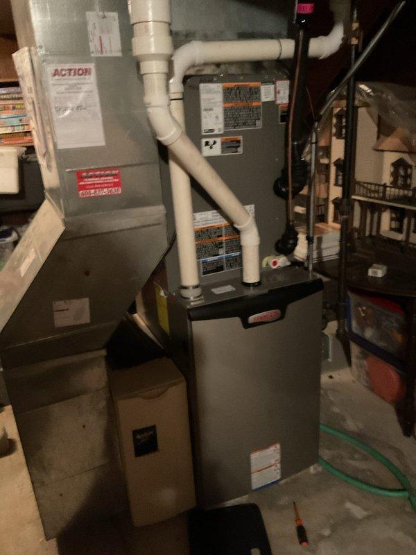 Completed comprehensive furnace tune-up on residential gas-fired forced air unit. Performed system diagnostics revealing igniter resistance at 50 ohms and combustion analysis showing 6 ppm carbon monoxide output. Cleaned flame sensor, replaced air filter, cleared drain trap debris, and tightened all electrical connections. Verified blower motor operation and confirmed unit heating properly with safe operational parameters.