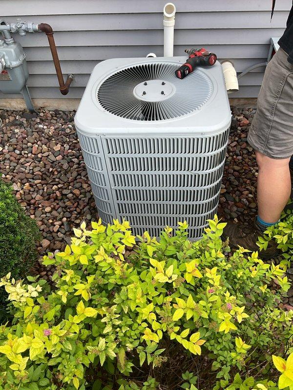 Completed comprehensive furnace and air conditioning tune-up on residential HVAC system. AC unit inspection revealed electrical connections, capacitor, and contactor in good condition with normal refrigerant pressures and suction line temperature at 45°F, confirming effective cooling operation. Hosed off and cleaned condenser coils, tested refrigerant charge levels, and verified system performance. 

Furnace inspection included thorough cleaning of flame sensor, testing igniter resistance at 15 ohms, and visual inspection of burners. Despite 20-year-old unit showing significant rust buildup, video scope inspection of heat exchangers revealed no cracks or holes. Verified blower motor operates freely and filter had been recently changed. Tested capacitor and contactor for proper operation. 

All safety checks passed with carbon monoxide levels measuring approximately 10 parts per million. Both heating and cooling systems confirmed operational and performing within normal parameters at co