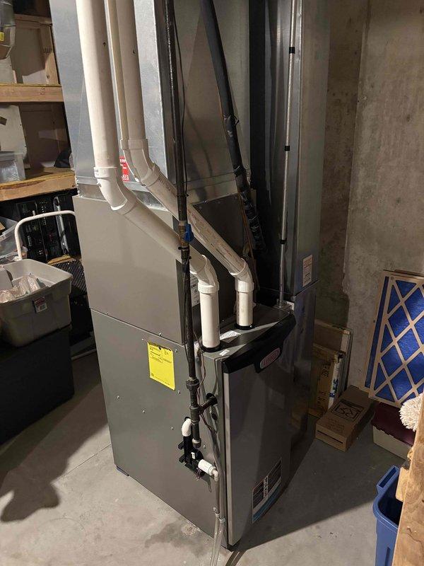 Completed comprehensive furnace tune-up and cleaning on residential heating system. Performed standard maintenance procedures including inspection of all major components, verified gas pressure readings at 1.7 mbar using digital manometer, and confirmed proper operation of venting system with PVC intake/exhaust configuration. All equipment found to be functioning within manufacturer specifications with no issues identified.