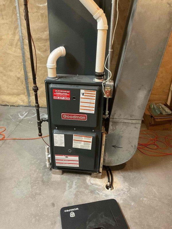 Completed comprehensive furnace tune-up on Goodman GMVC960603BNBC unit. Performed full system inspection including electrical connections, blower assembly, and combustion analysis with CO reading at 9 ppm and temperature rise at 48°F. Cleaned flame sensor, blew out pressure switch ports and header box, tightened electrical connections, and serviced drain trap. System operating in good condition with all components functioning within manufacturer specifications.