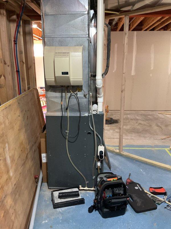 Responded to service call for both furnace and water heater pilot lights out. Upon arrival, natural gas detector had previously alarmed, causing automatic pilot shutoff on water heater. Investigation revealed gas valve leaking on furnace, with natural gas detected coming from first burner orifice when gas valve was turned off. 

Conducted thorough inspection of 21-year-old furnace system and water heater. Water heater burner area showed significant rust accumulation. Removed burner assembly and vacuumed out burners and bottom of water heater tank. Cleaned flame sensor, burners, and igniter on water heater to restore proper operation. Performed flue gas analysis using combustion analyzer to verify safe operating parameters.

Due to age of furnace unit and leaking gas valve presenting safety concern, provided options for gas valve replacement versus complete furnace replacement. Awaiting decision on repair versus replacement before proceeding with final resolution.