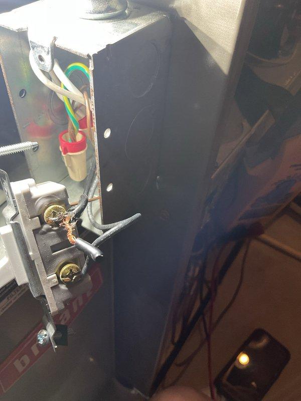 Responded to service call for non-operational furnace on 1.5-year-old unit. Upon inspection, discovered electrical disconnect switch on side of furnace had improper wiring with rubber debris inside connector and inadequate wire connections that were not making proper contact or secured correctly. Removed faulty wiring, cut and installed new wire to top terminal of disconnect switch, and properly secured all connections. Cycled unit through heating and cooling modes to verify proper operation and confirmed furnace now powers on and off correctly.