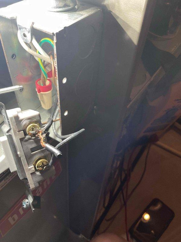 Responded to service call for non-operational furnace on 1.5-year-old unit. Upon inspection, discovered electrical disconnect switch on side of furnace had improper wiring with rubber debris inside connector and inadequate wire connections that were not making proper contact or secured correctly. Removed faulty wiring, cut and installed new wire to top terminal of disconnect switch, and properly secured all connections. Cycled unit through heating and cooling modes to verify proper operation and confirmed furnace now powers on and off correctly.