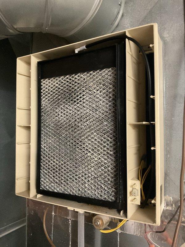 Completed furnace clean and check for rewards member. Performed comprehensive maintenance inspection of heating system, including examination of air filtration unit with clean white mesh filter in proper working condition. Verified operation of Honeywell LU8X18 automatic rectangular damper (8"L x 18"H) and associated M847D control actuator with proper wiring connections intact. All components functioning within normal parameters with no immediate service needs identified.
