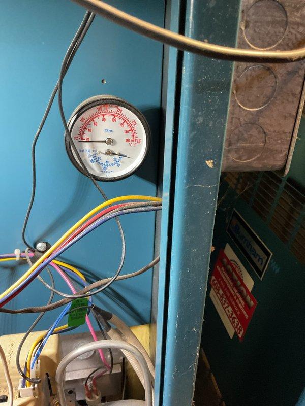 Responded to no heat call on residential boiler system. Upon arrival, discovered boiler had no power supply despite recent electrical panel upgrade. Investigation revealed that electrician had failed to connect boiler circuit to new breaker panel during installation. Established proper electrical connection from breaker panel to boiler unit, restoring power to system.

Following electrical connection, boiler fired successfully and unit achieved normal operation. However, during system check, identified that system water pressure was reading zero PSI on pressure gauge. Determined that automatic fill valve was not functioning and failing to maintain proper system pressure. Without adequate water pressure, boiler would be unable to operate safely or efficiently long-term.

Documented model and serial number information from existing auto fill valve for parts ordering purposes. Explained to customer that replacement of defective auto fill valve would be necessary to maintain proper system 