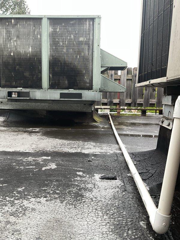 Responded to service call for non-operational air conditioning system at commercial facility. Upon arrival, inspected rooftop HVAC equipment including multiple RTU condensers and air handling units. Diagnosed system malfunction, performed necessary repairs to restore cooling operation, and verified all equipment returned to normal working condition.