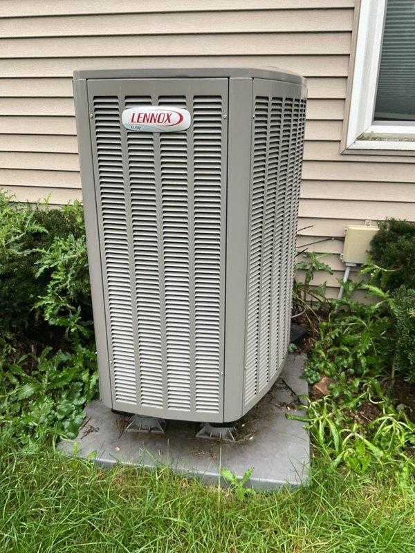 Responded to no cooling complaint on 2022 Lennox EL15XP1-018-230A01 system blowing warm air. Performed diagnostic inspection including verification of refrigerant charge levels, air filter condition, condensate drain line functionality, and outdoor condenser unit operation. Investigated potential thermostat compatibility issues following recent thermostat replacement to determine if improper wiring or configuration was contributing to system malfunction.
