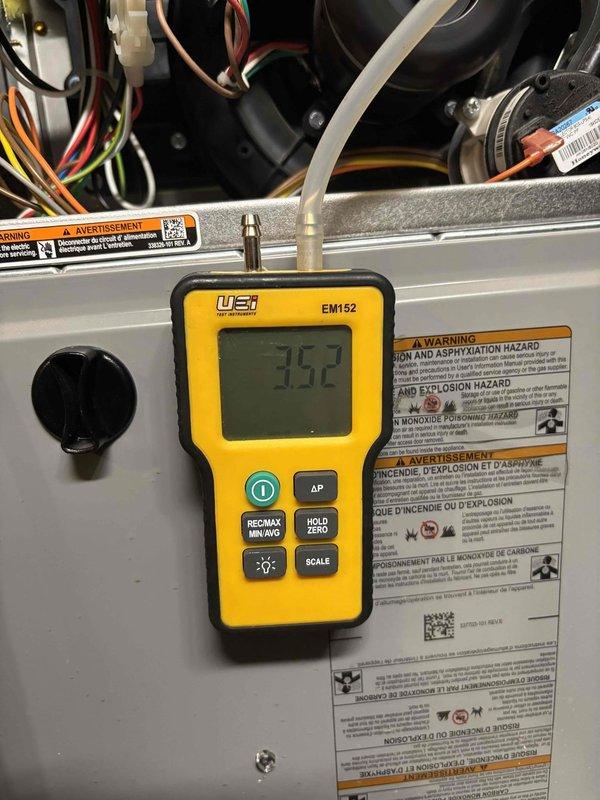 Completed scheduled furnace clean and check for rewards member. Performed comprehensive system inspection and cleaning of heating unit. Verified supply air temperature at 75.3°F and return air temperature at 25.5°F, confirming proper temperature rise across heat exchanger. Utilized calibrated digital thermometers and differential pressure gauge (reading 52) to assess system performance. Inspected internal components including blower motor, heat exchanger, gas connections, copper refrigerant lines, and electrical wiring. All safety labels and warnings verified intact on equipment panel. System operating within normal parameters with no deficiencies noted.