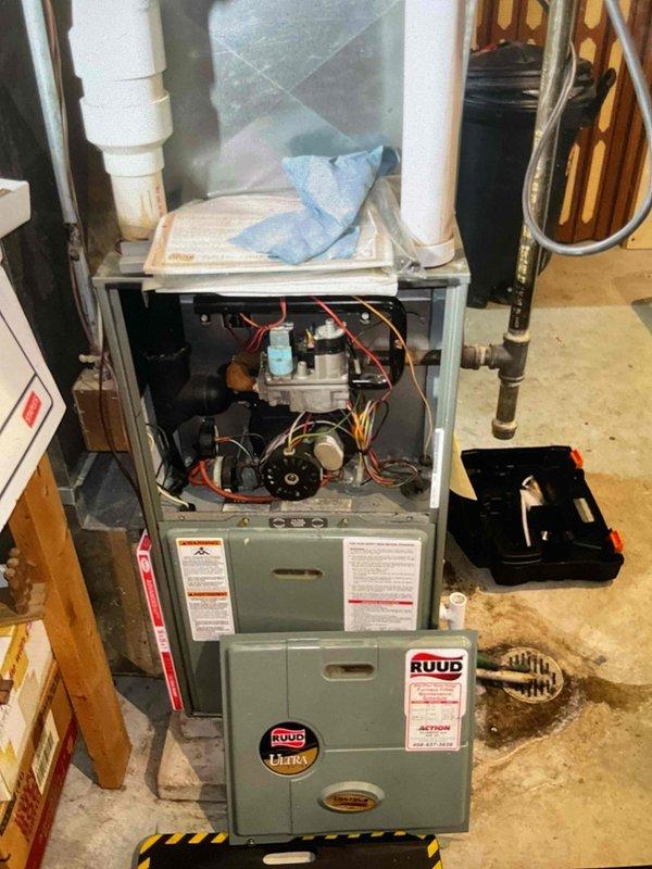 Performed comprehensive furnace cleaning and inspection on Ruud heating system. Accessed internal components, inspected blower motor assembly, gas valve, wiring harnesses, and all mechanical systems. System is operating properly with all components functioning within normal parameters.