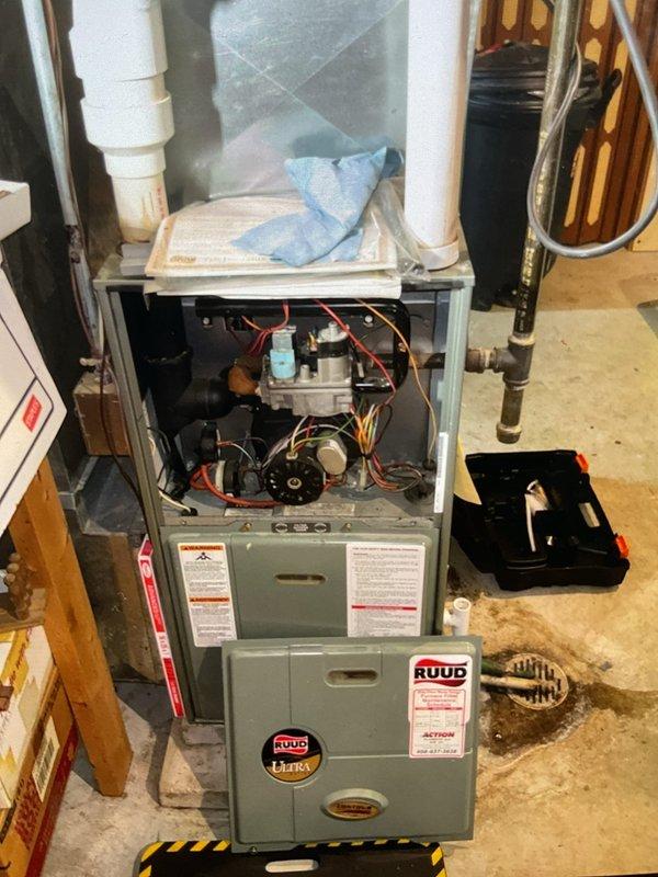 Performed comprehensive furnace cleaning and inspection on Ruud heating system. Accessed internal components, inspected blower motor assembly, gas valve, wiring harnesses, and all mechanical systems. System is operating properly with all components functioning within normal parameters.