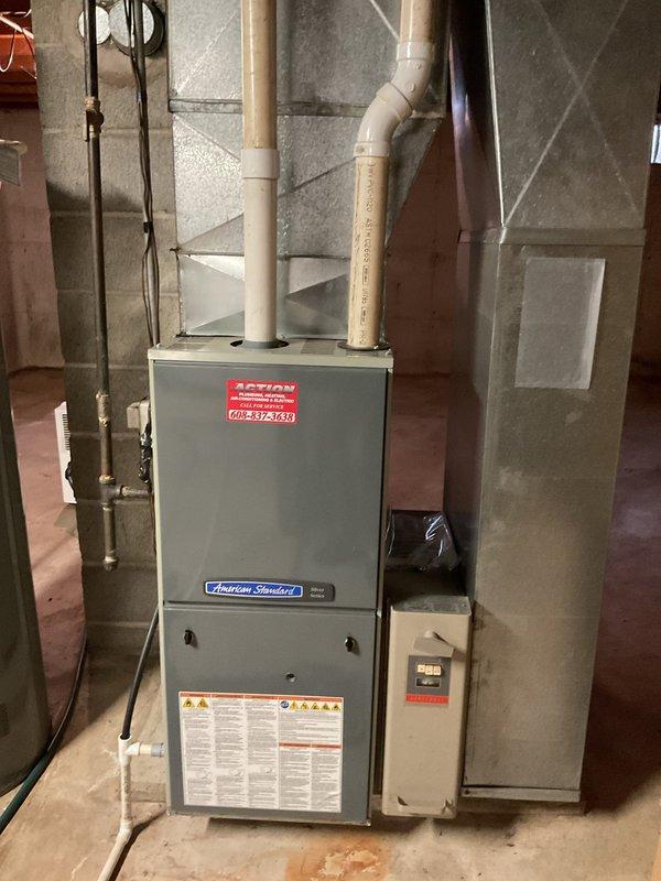 Completed comprehensive furnace tune-up on American Standard unit. Replaced air filter and cleaned flame sensor which had accumulated buildup affecting operation. Inspected all condensate drain lines and confirmed clear of obstructions. Verified igniter resistance at 16 ohms within acceptable range, measured combustion analysis showing CO levels at 8 ppm, and confirmed proper heat rise with delta T of 60 degrees, indicating optimal system performance.