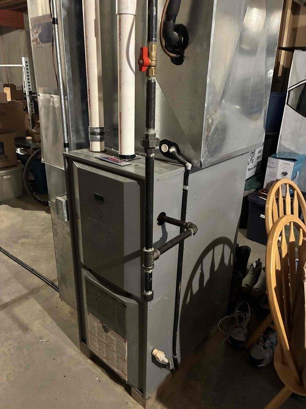 Responded to service call for furnace inspection. Upon arrival, detected natural gas leak at 90° fitting inside furnace cabinet. Performed thorough safety inspection of gas supply system and other furnace components. Shut off gas supply, removed defective 90° gas fitting, and installed new fitting with proper thread sealant. Pressure tested gas connections to verify leak-free operation. MGE notified and marked location. System returned to safe operational status.