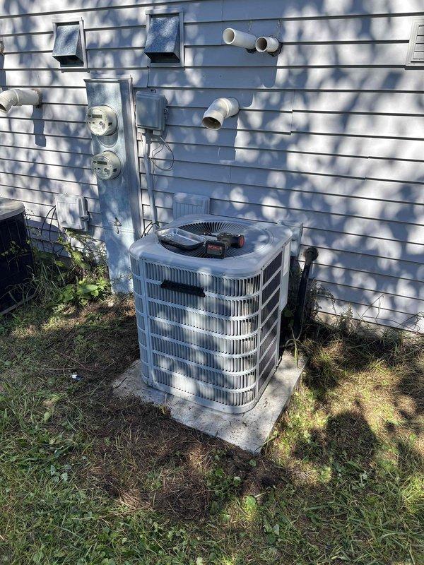 Performed routine air conditioning clean and check service on residential Lennox HVAC system. Inspected outdoor condensing unit with cylindrical cage design and indoor furnace installation in basement. Completed standard maintenance procedures including cleaning condenser coils, checking refrigerant levels, verifying electrical connections, and testing system operation. All equipment found to be functioning properly with no issues identified.