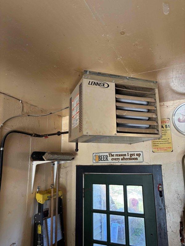 Responded to no heat call for Lennox garage heater unit. Diagnosed and confirmed failed induction motor preventing unit operation. Documented equipment condition and motor failure for customer records.